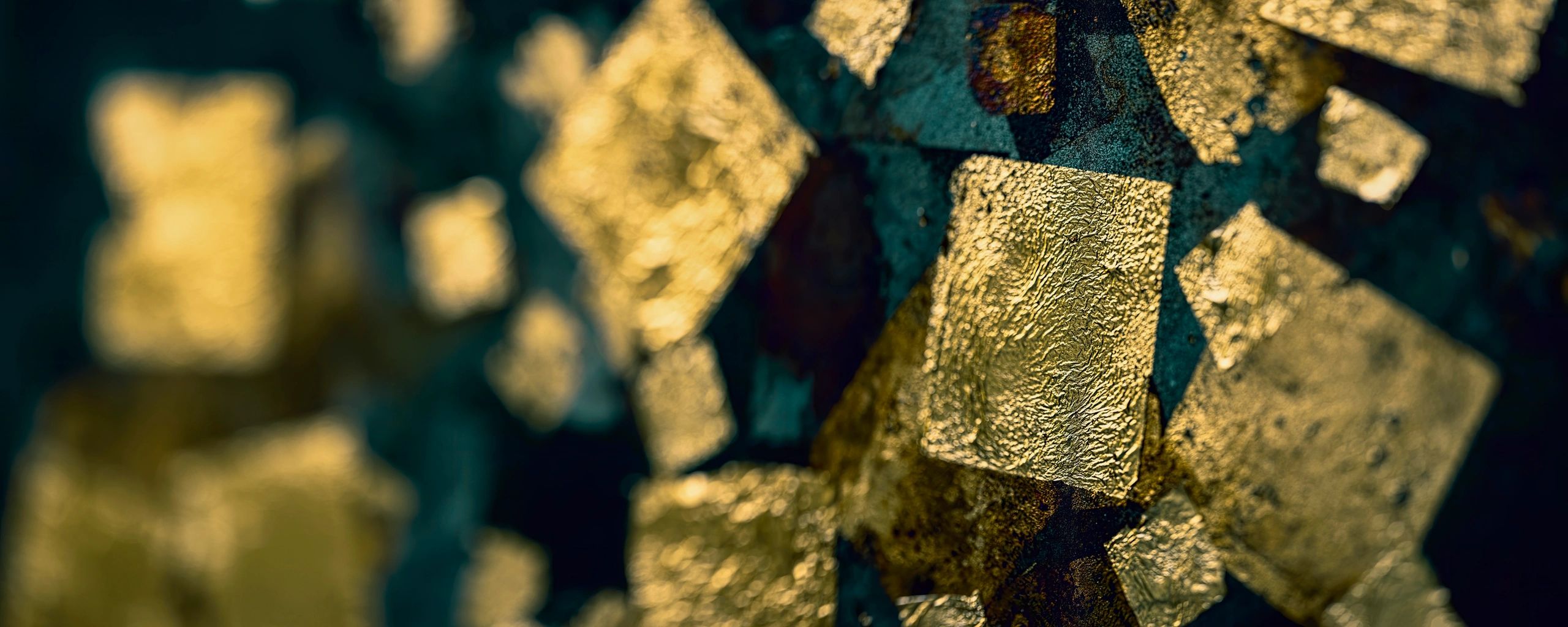 Textured gold-toned background representing precious metals